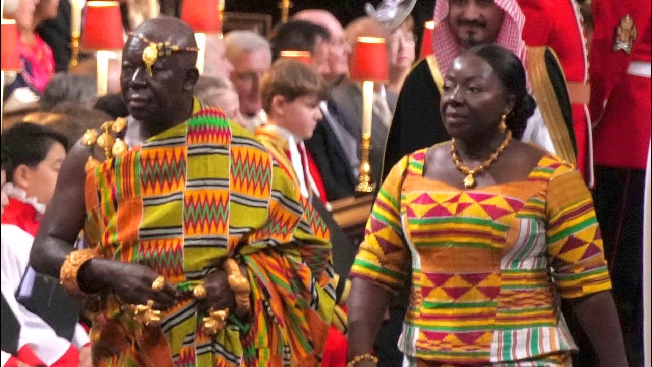 ASANTEHENE AND WIFE LADY JULIA ADORNED IN KENTE AT KING CHARLES CORONATION IN WESTMINSTER ABBEY.