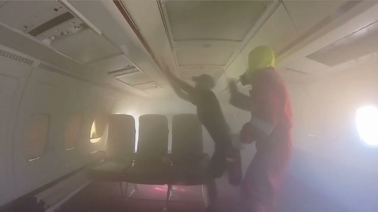 Aircraft Fire Evacuation and Fire Fighting Cabin Crew Training smoke filled cabin