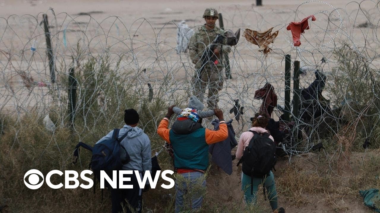 Hundreds of migrants cross razor wire into Texas