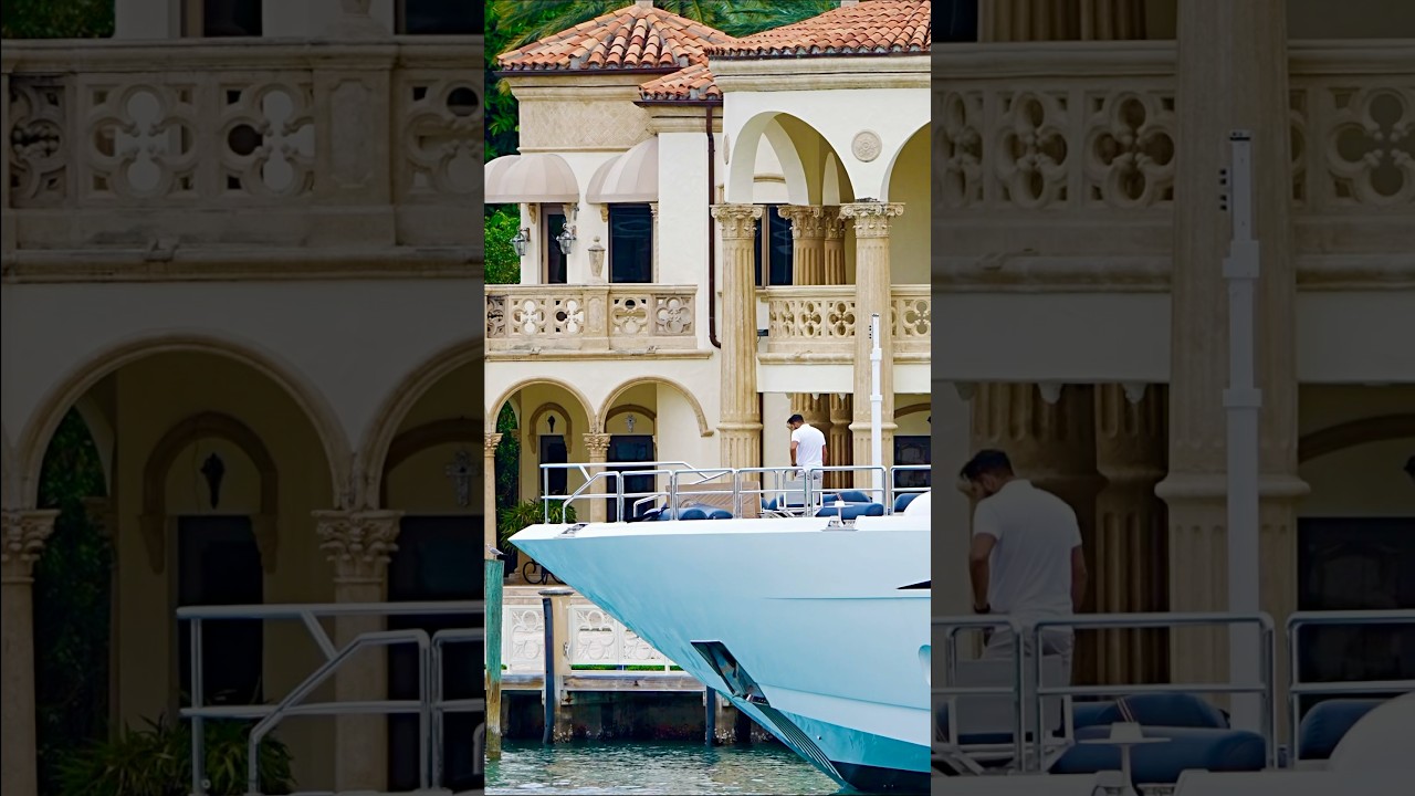 The 152 foot Leopard yacht passing that famous mansion in Bal Harbour, Florida.