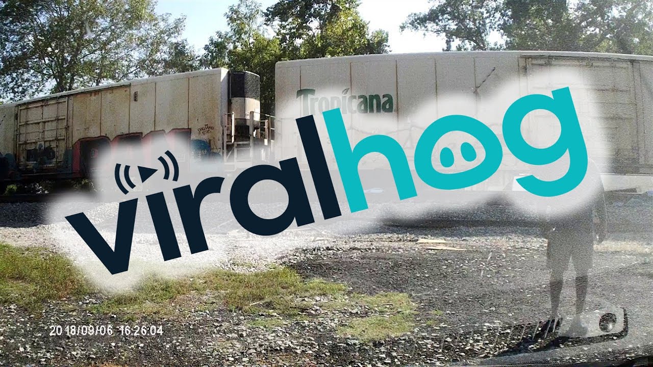 Semi-Trailer Sliced in Half by Freight Train || ViralHog