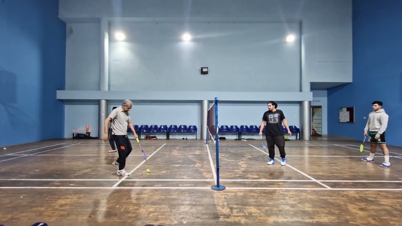 "Intense Rallies and Smashes: Epic Badminton Showdown!"