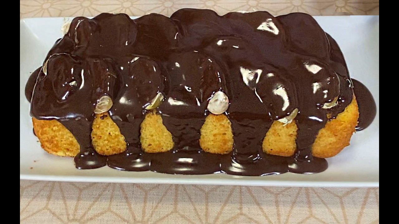 A Delicious Sumo Tangerine Cake Garnished with Melted Chocolate and Fresh Tangerines---😋