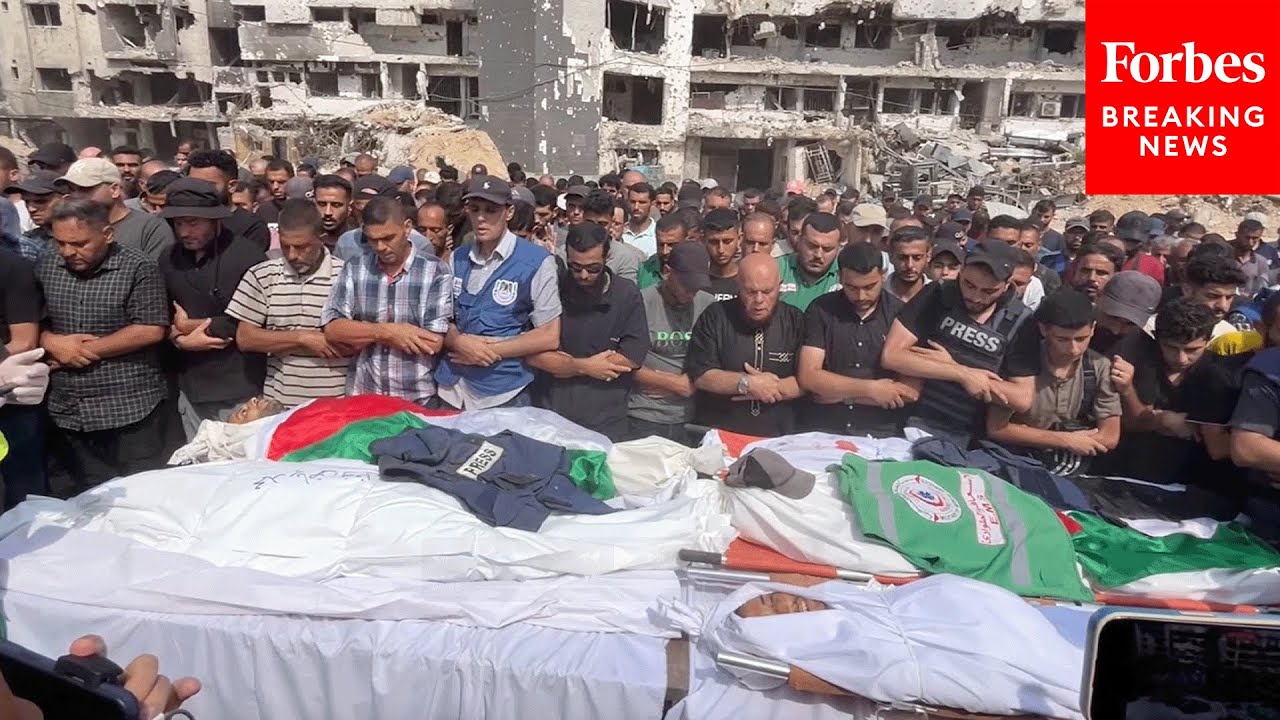 Crowds Gather For Funerals Of Palestinian Journalists Killed By Israeli Airstrike