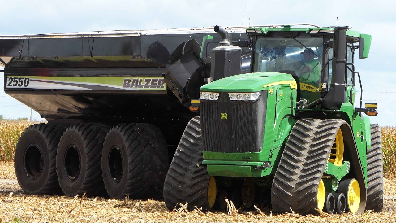 John Deere 9RX 640 with BALZER 2550 Auger Wagon harvesting Corn