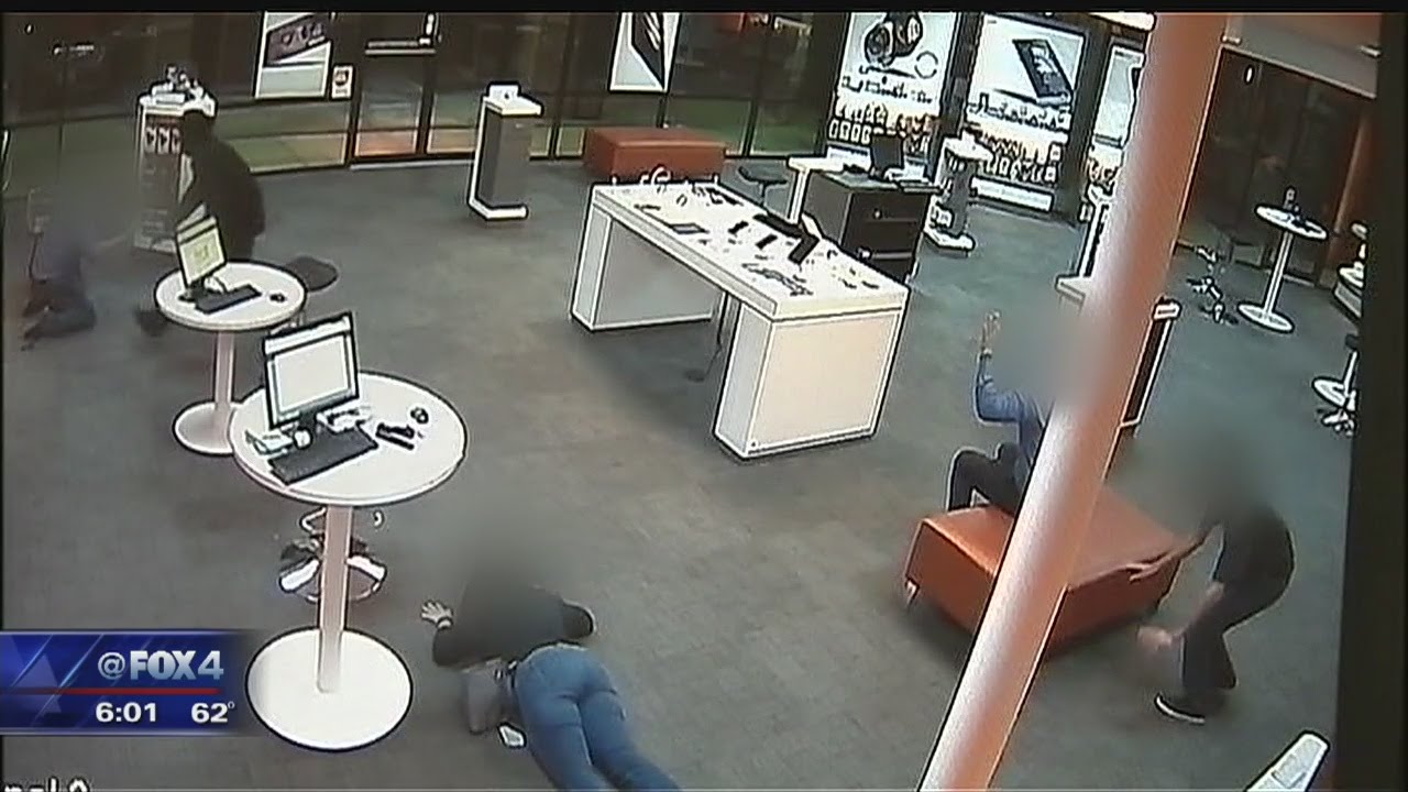 Two robbers beat up an employee during their ransacking of Arlington AT&T cell phone store