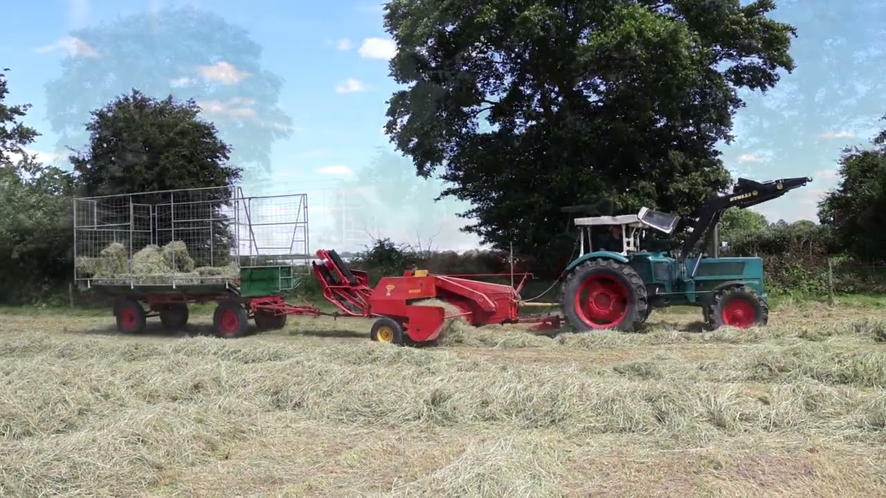 Hanomag Brillant 700 mit Welger Presse im Heu.