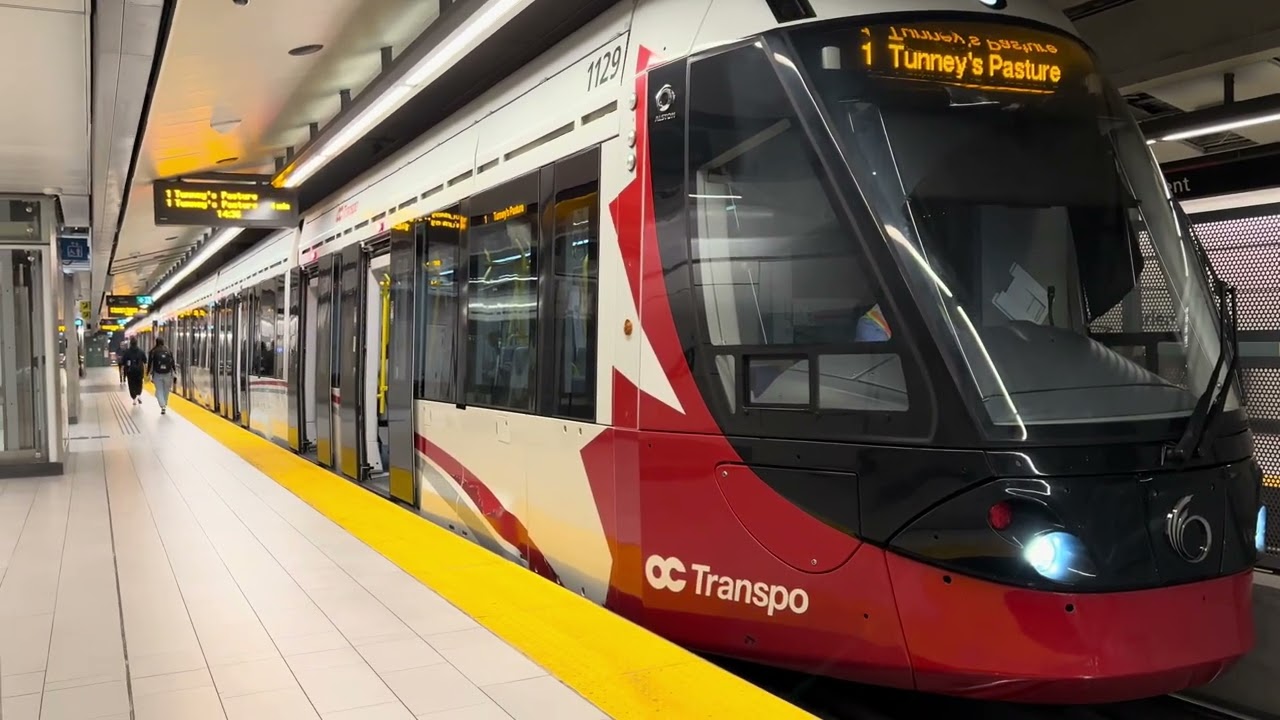 OTTAWA LIGHT METRO TRAINS IN ACTION AT PARLIAMENT STATION
