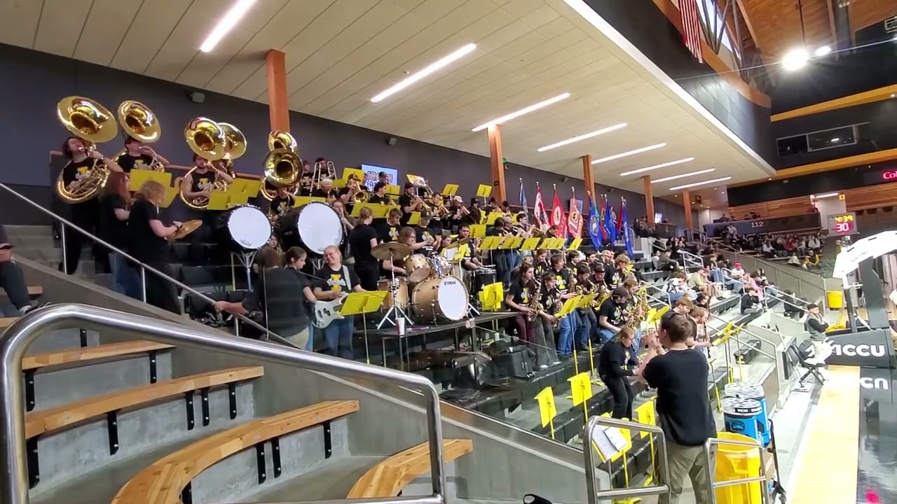 Idaho Vandals Pep Band playing Light um up, with the Vandals Spirit Squad on court.