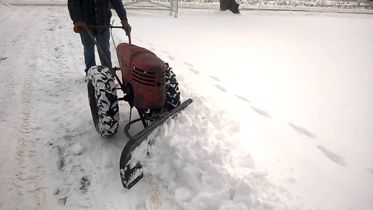 David bradley tractor plowing snow