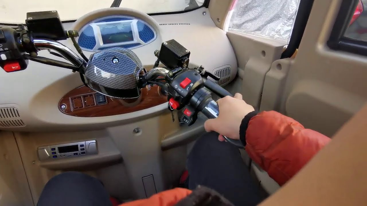 first person perspective driving test electric cabin trike on the small road