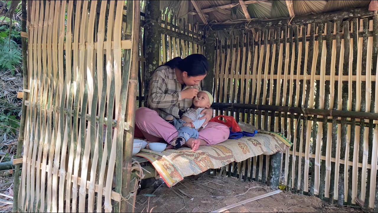Single mother raising her child alone - Poor single mother builds shelter in the forest