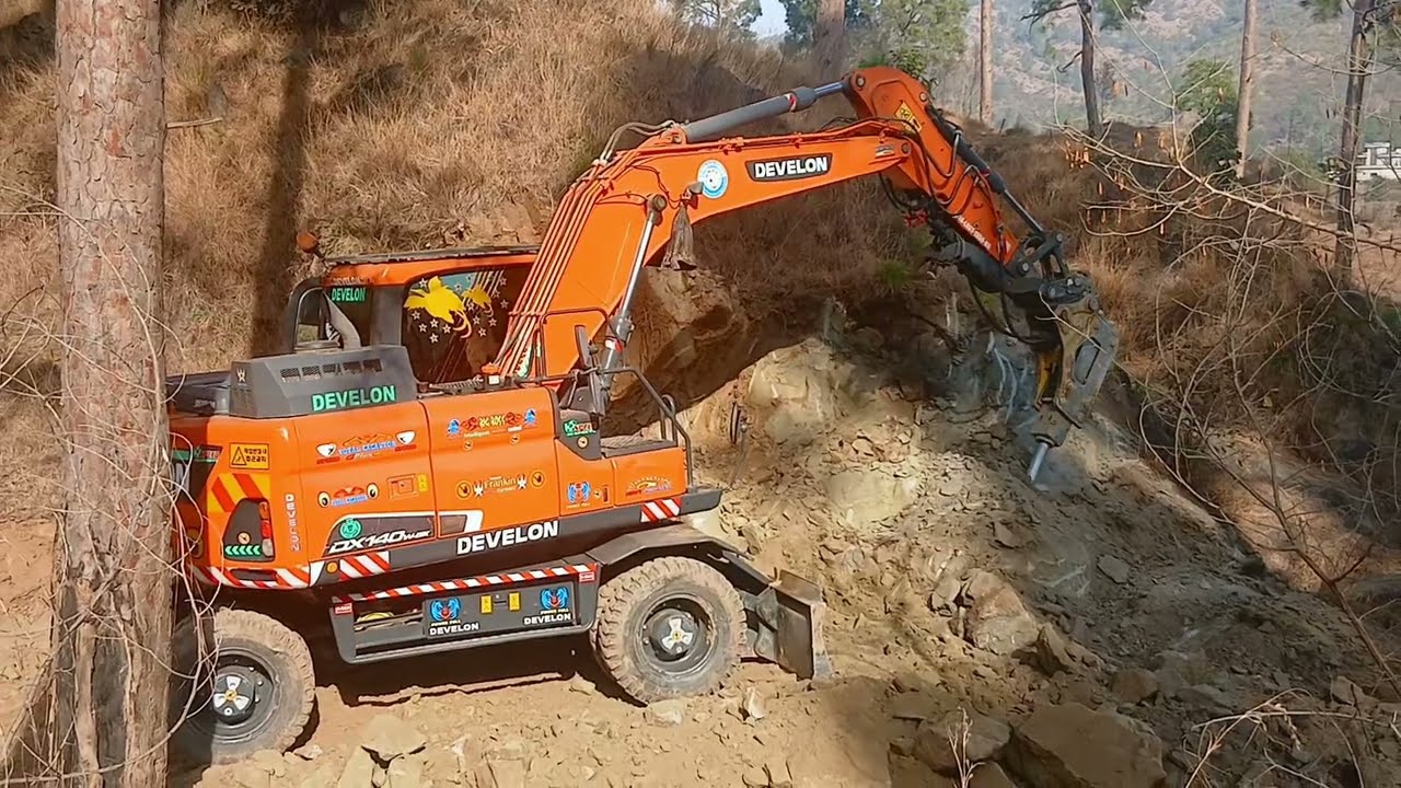 Excavator is Digging the Mountains stone to make the place for road #excavator 