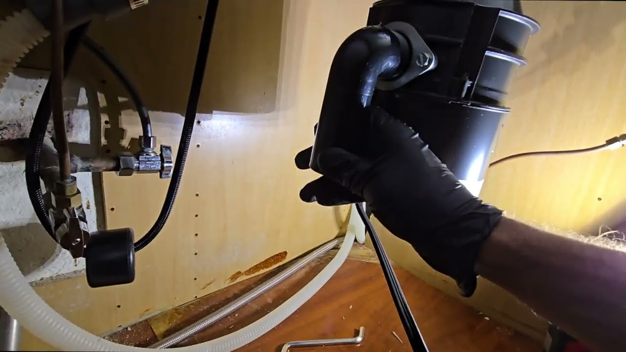 How to replace a garbage disposal and repipe the kitchen sink drain