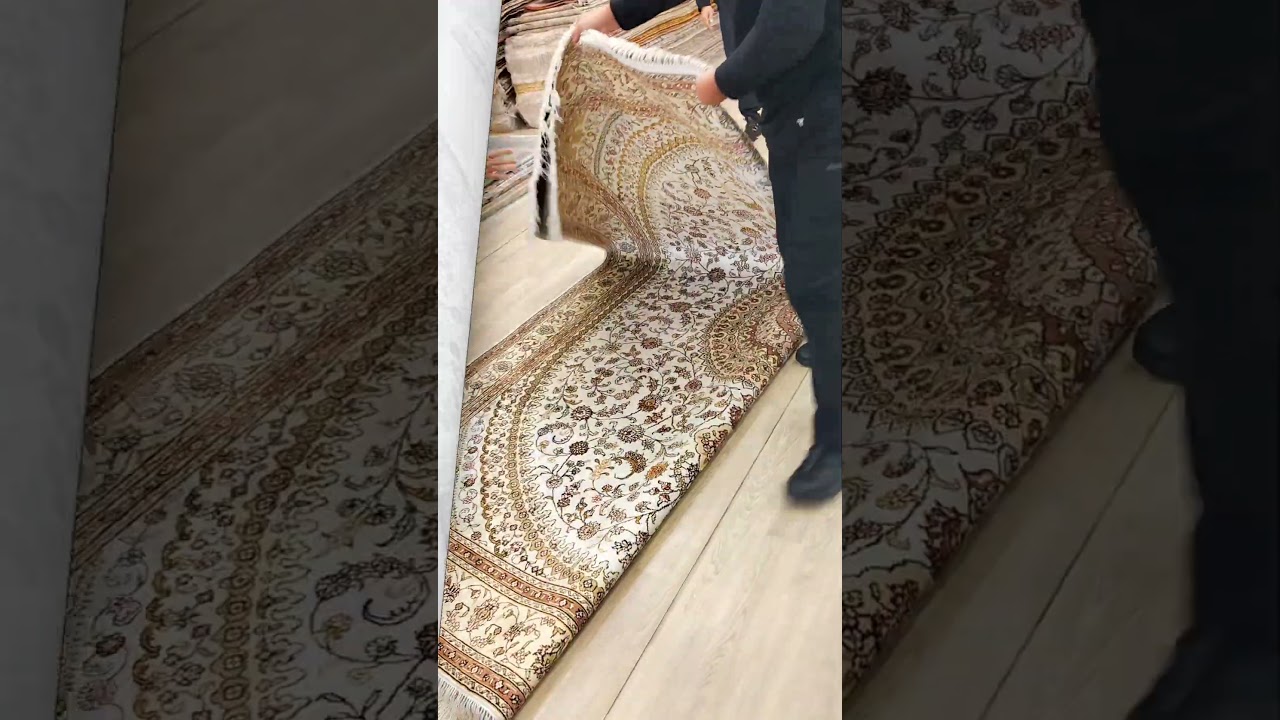 The beige 8x10ft hand-made silk carpet is elegant.