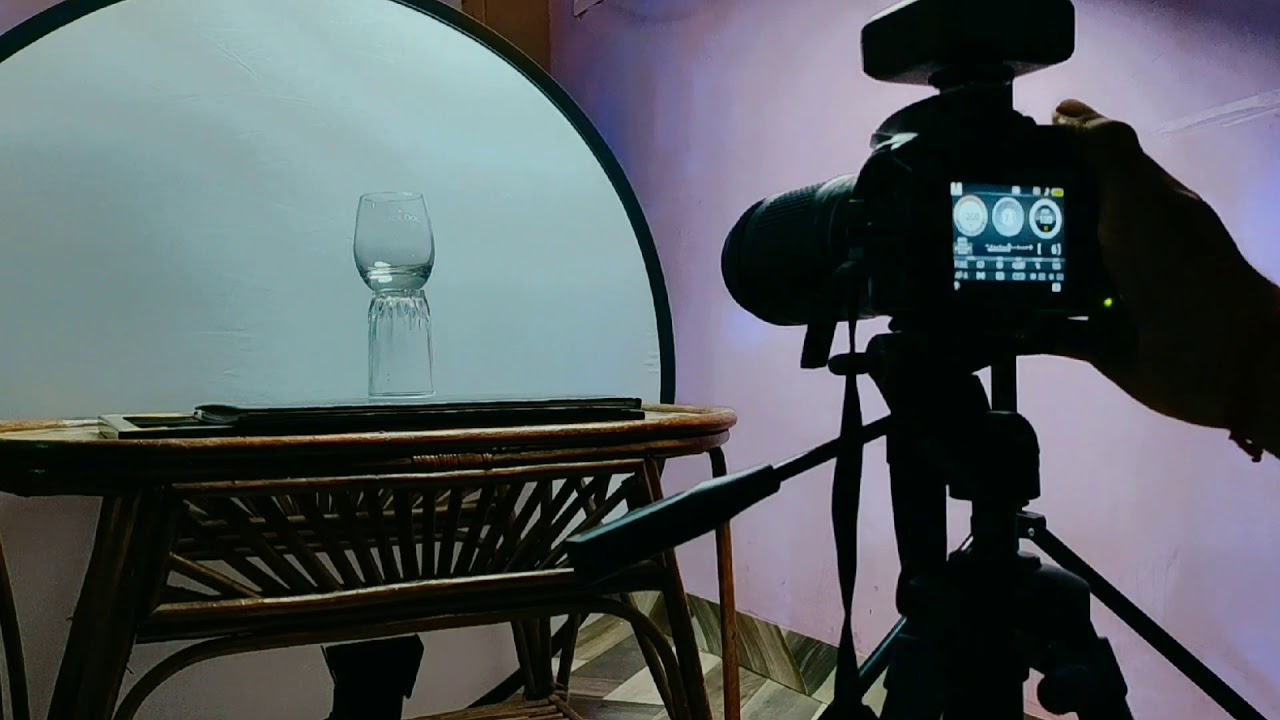 PHOTOGRAPHING GLASS / GLASS WARE ON WHITE.