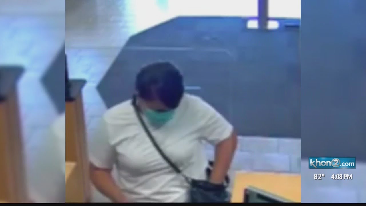 Police search for a woman suspected of a bank robbery