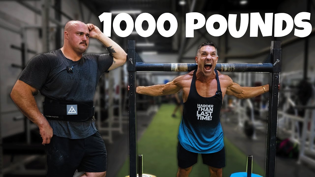 Грег Дусетт пытается поднять хомут весом 1000 фунтов...