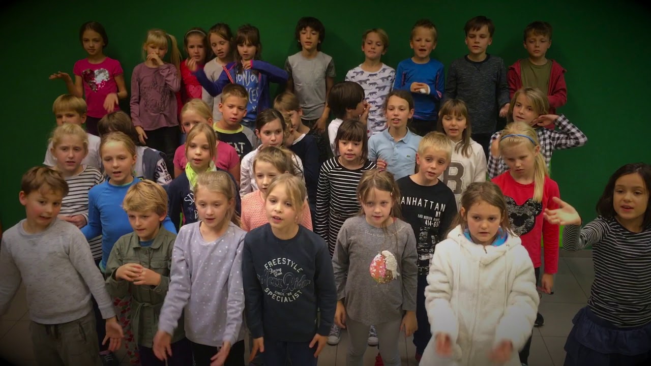 Grades 1,2 and 3 sing 