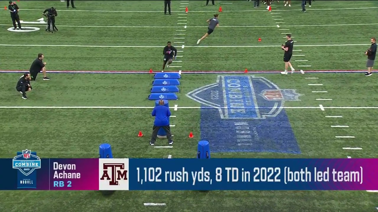 Aggies Devon Achane bulldozes a tackle dummy into the ground after a juke move