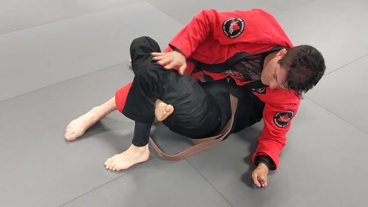 Jean Jacques Machado Rolling with Brown Belt Student