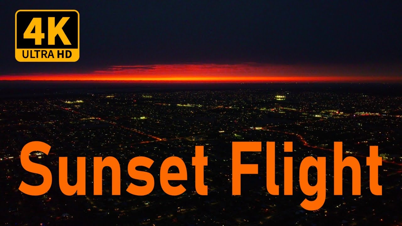 Sunset Drone View with City Lights - 4K