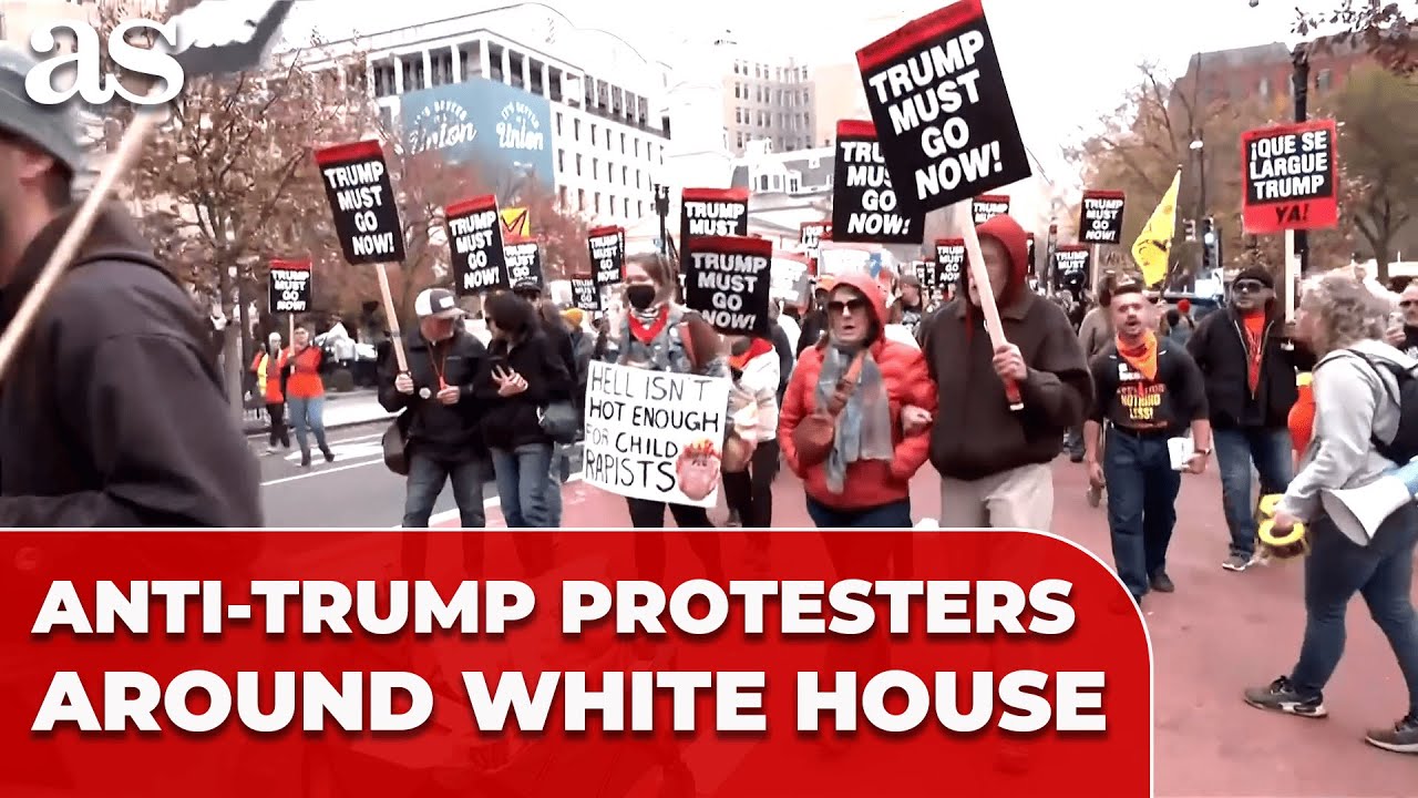 ANTI-TRUMP protesters wrap ‘CRIME SCENE’ tape around the WHITE HOUSE