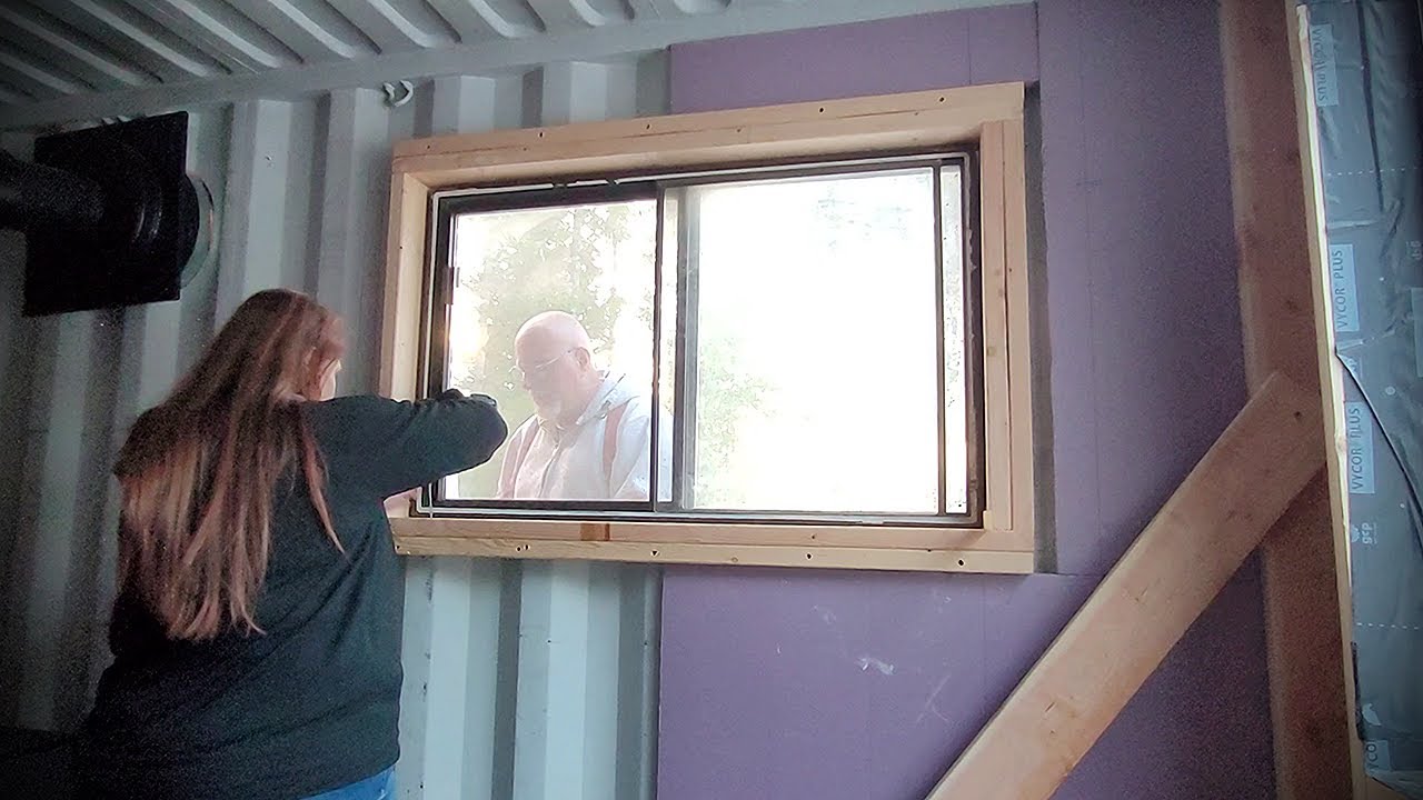 DIY Shipping Container Tiny Home build// Wood window frames for kitchen window // OFF GRID VLOG