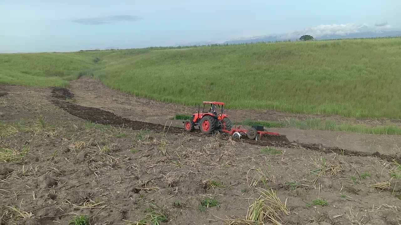 Kubota 108s Tractor harrowing.