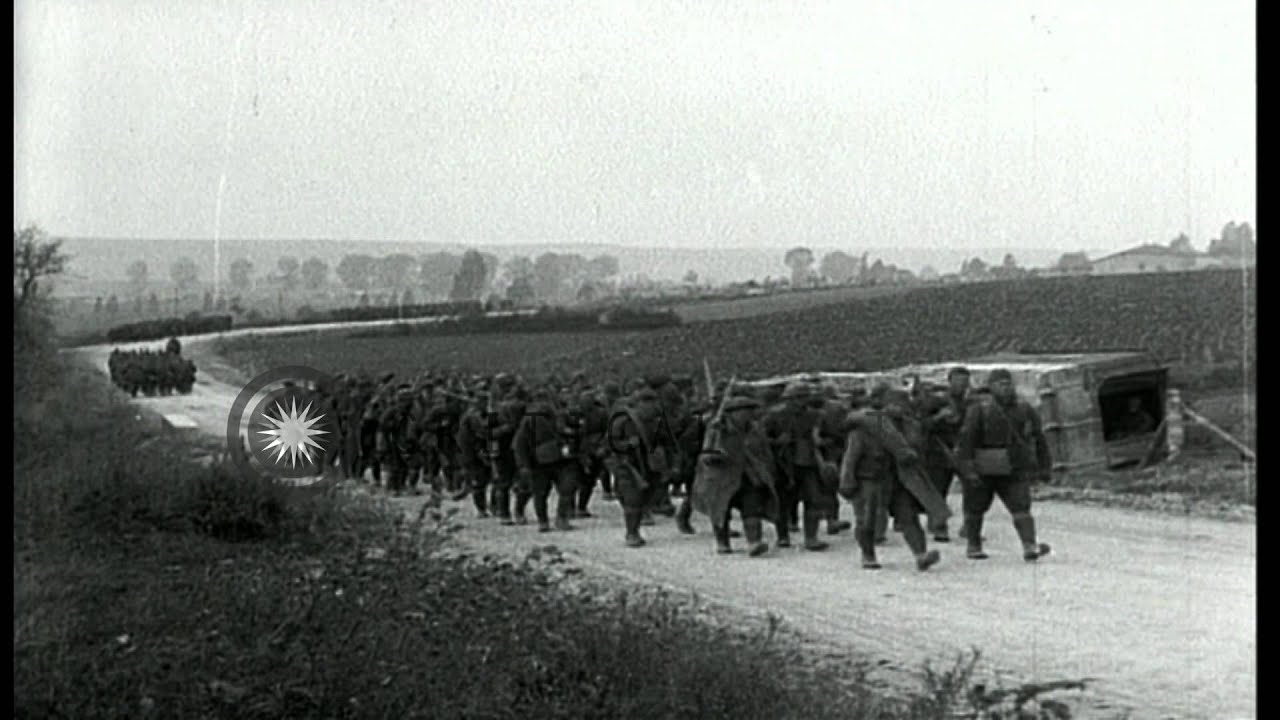 137th Infantry troops moving along country road in France, during World War 2 HD Stock Footage