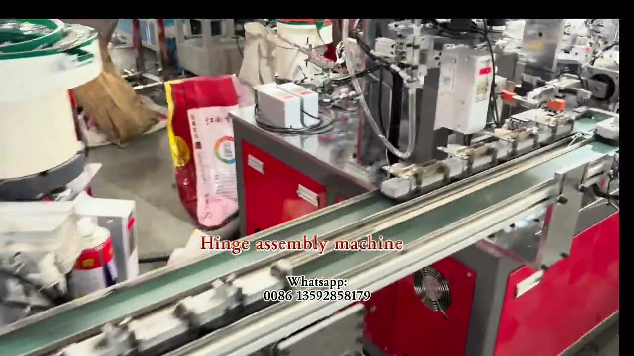 Hinge assembly machine is in testing . China Red 🇨🇳 — Prosperity in Full Bloom.