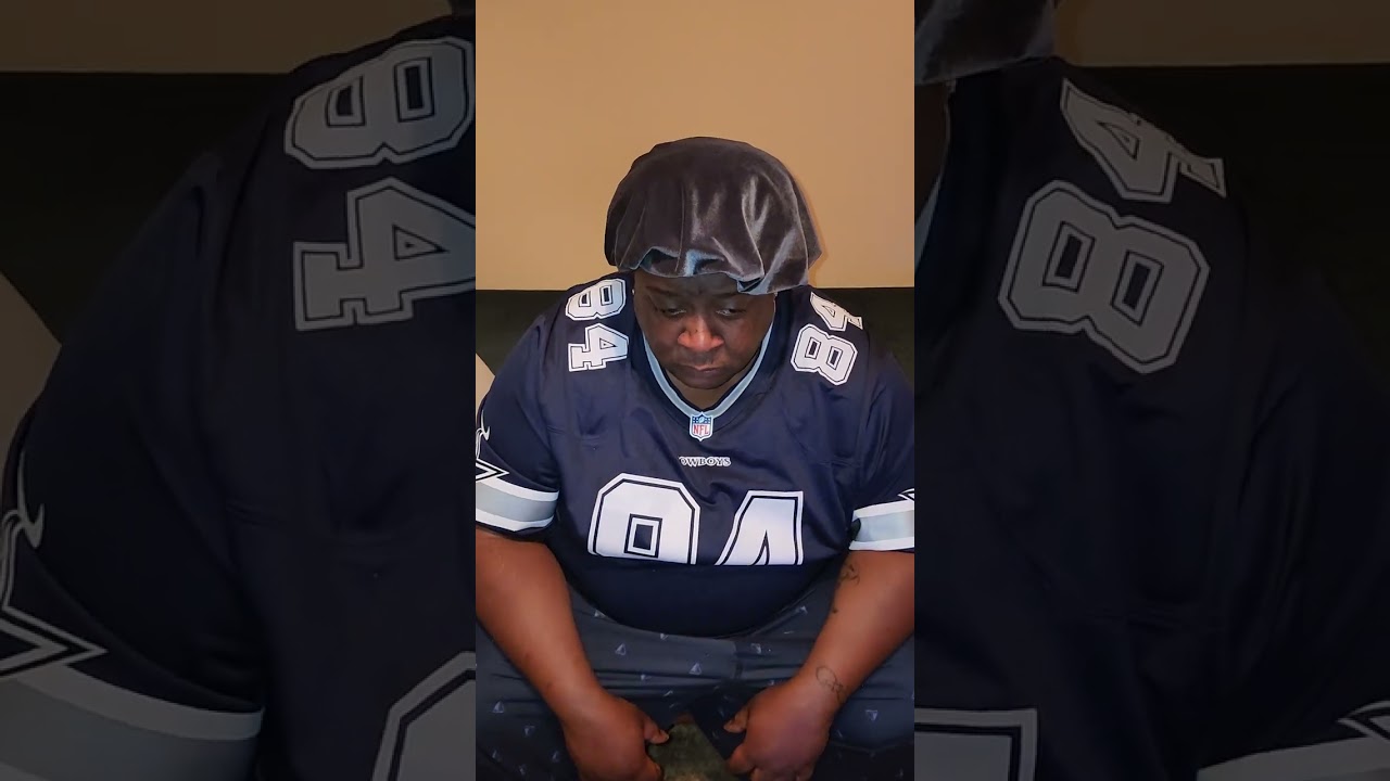Cowboys fan distraught after losing in the first round to the Packers.
