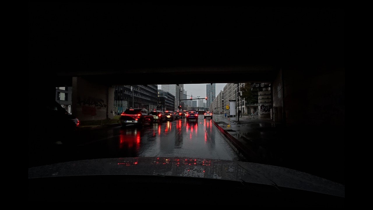 Driving through the city in the evening, in the rain, to sleep, to work, to study
