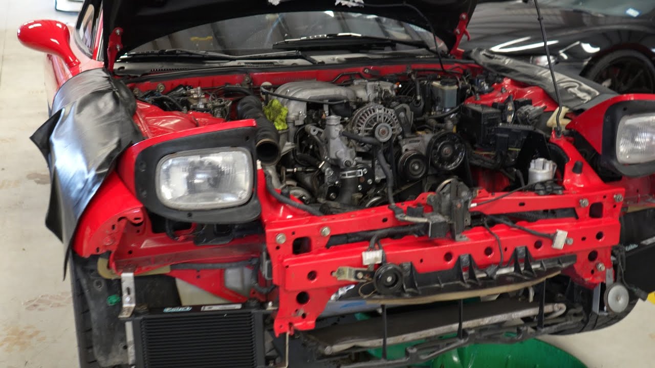 The FD RX7 gets AutoEXE carbon fiber ram air intake, KoyoRad rad and dual Setrab oil coolers