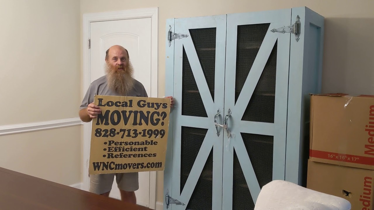Asheville Local Movers Unloading PODS at The Groves at Town Center Apartments in Fletcher NC