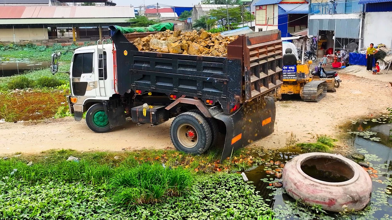 WONDERFUL Impressive Project Land Filling !!! Bulldozer D20P Push Stne & Dump Truck 5Ton Unloading