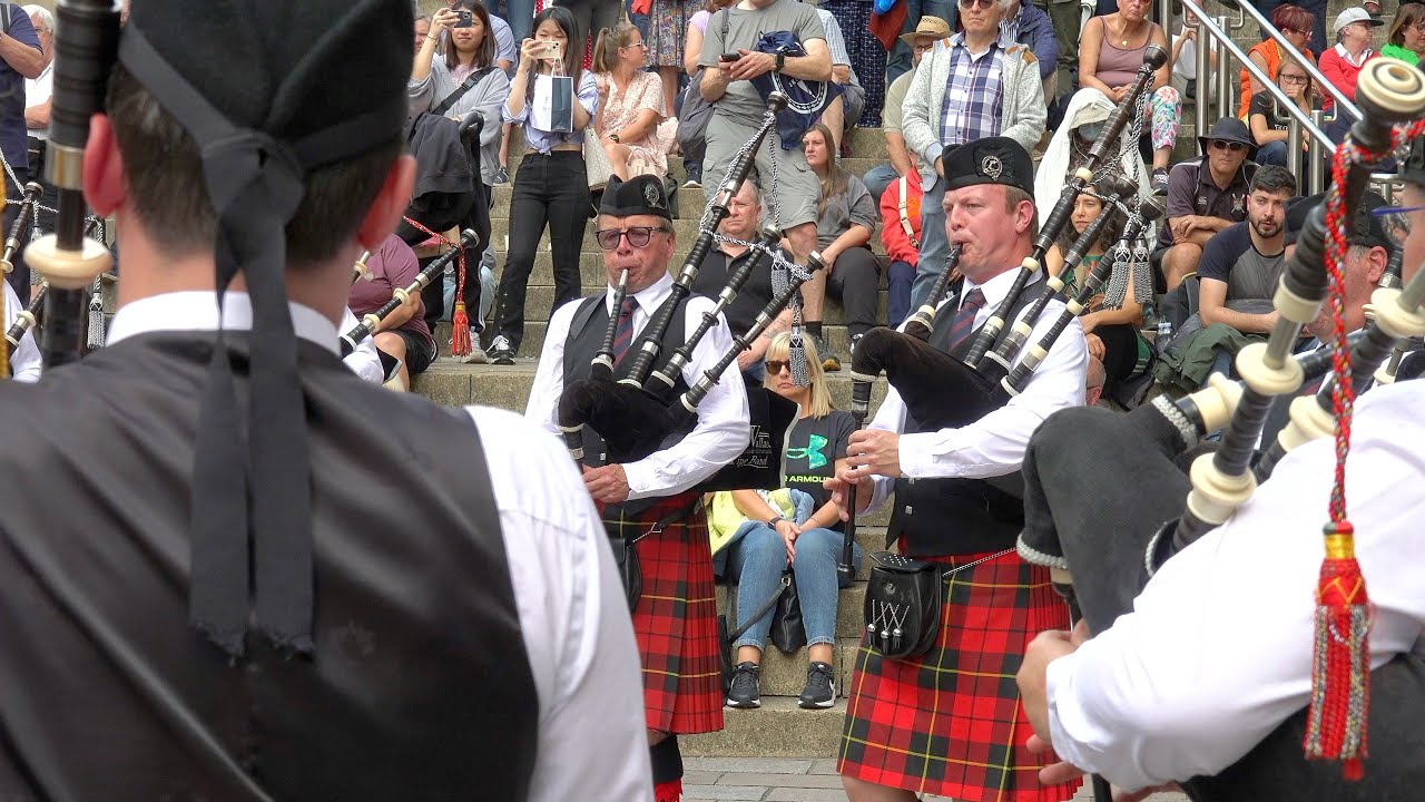 Riverside Alliance Pipe Band from Belgium playing by Glasgow Concert Hall during Piping Live 2023