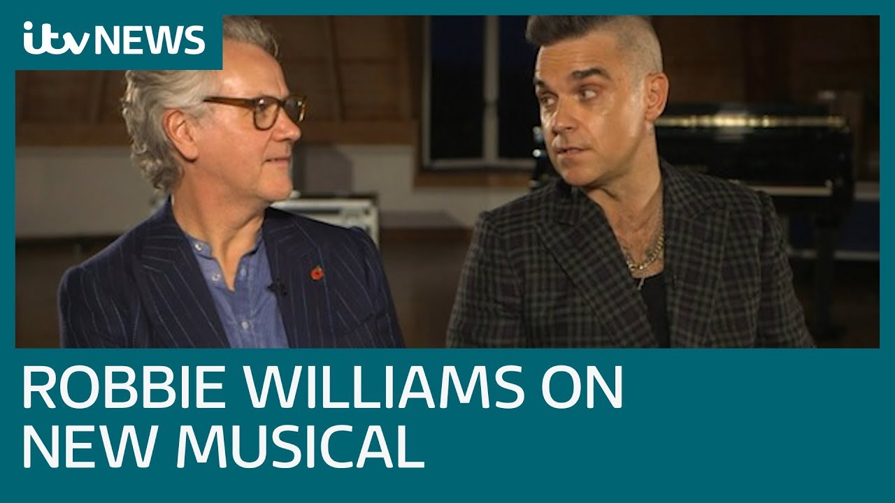 Robbie Williams reunites with Guy Chambers  for The Boy in the Dress | ITV News