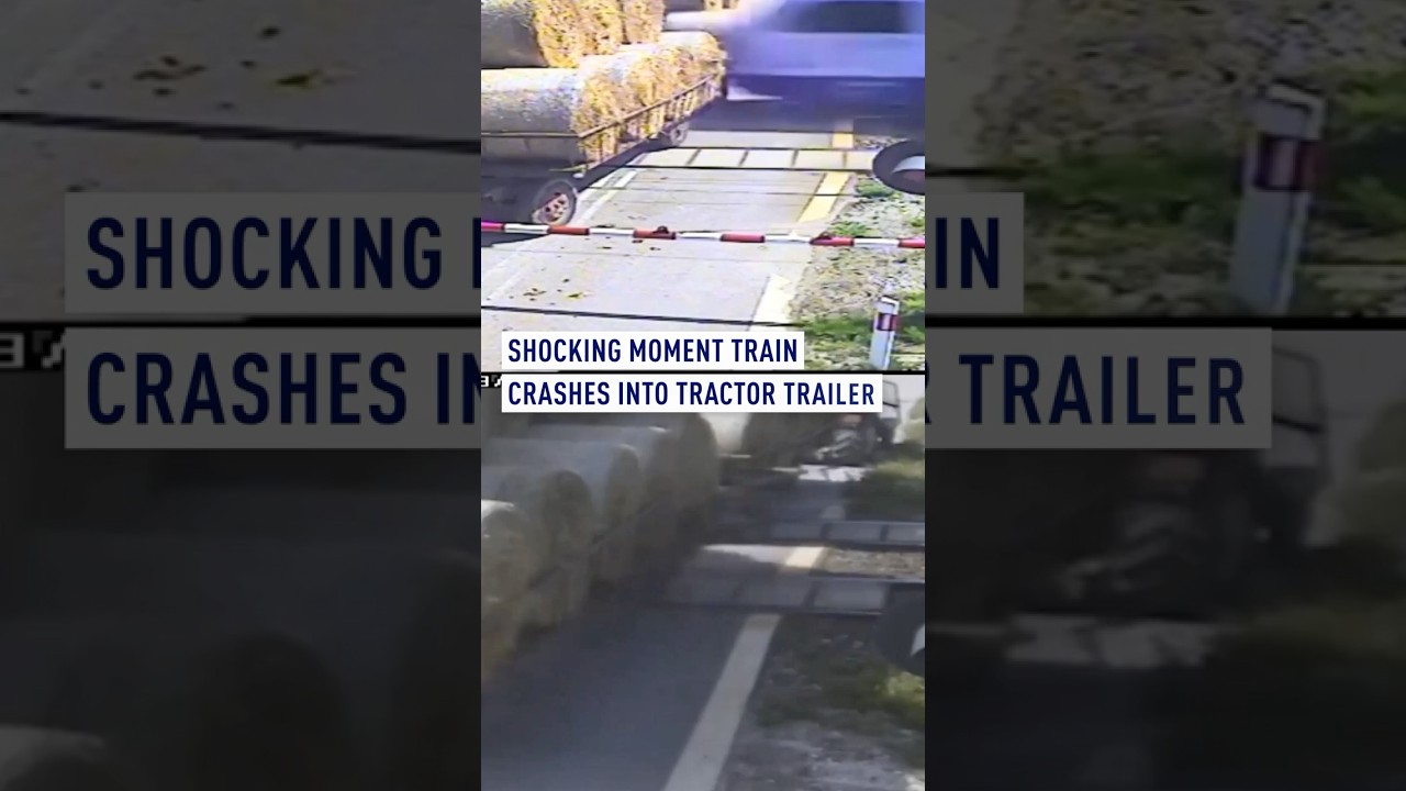 Shocking moment train crashes into tractor