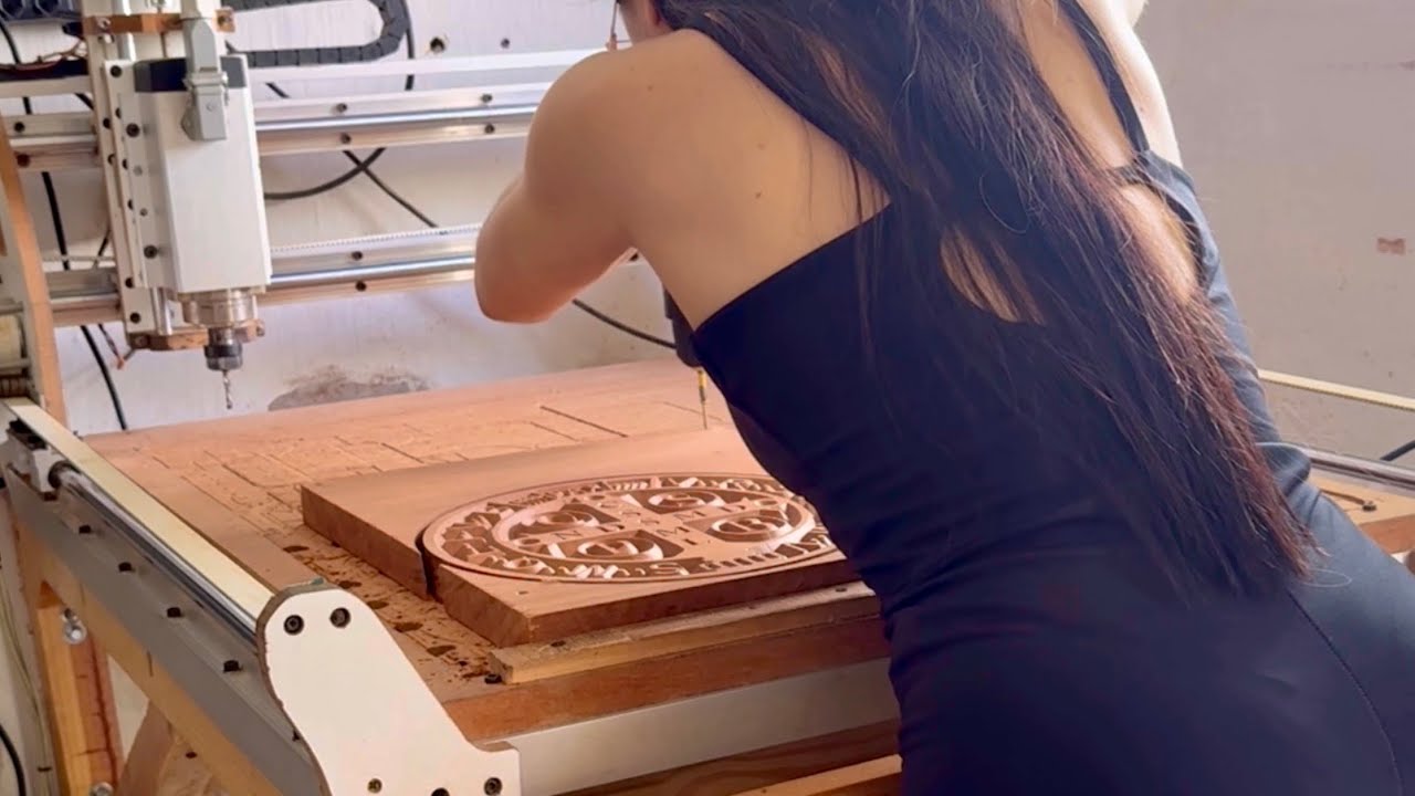 She made the Saint Benedict medal in wood using a CNC router
