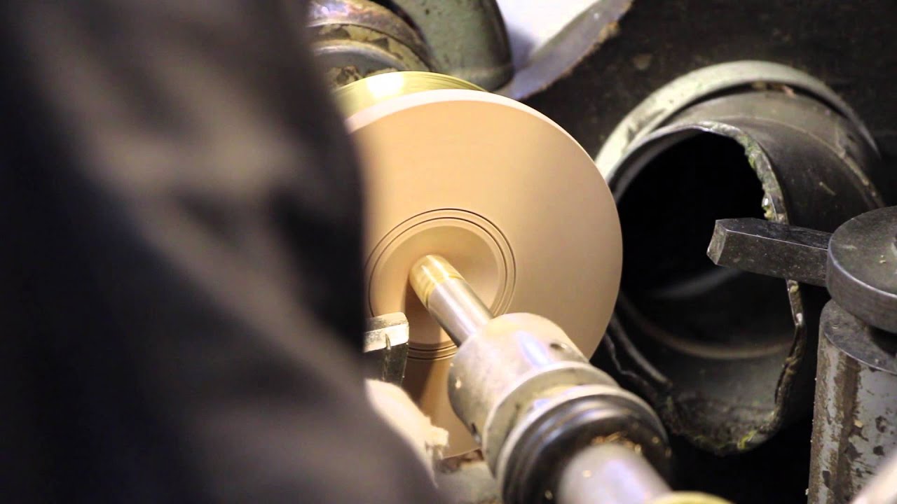 Hand turning and shaping PEETZ Classic Series mahogany fishing reels