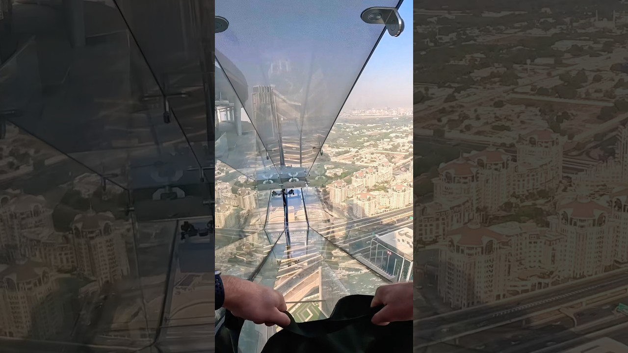 Scariest glass slide, over 200 metres off the ground! Sky Views Observatory Dubai #travel #scary