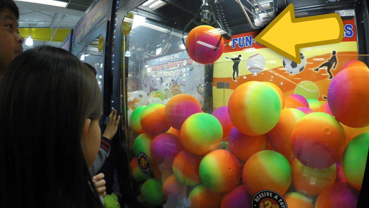 Claw Machine Arcade Game Wins On The Skill Crane - Kids Practice Their Clawing Skills On Sure Bets