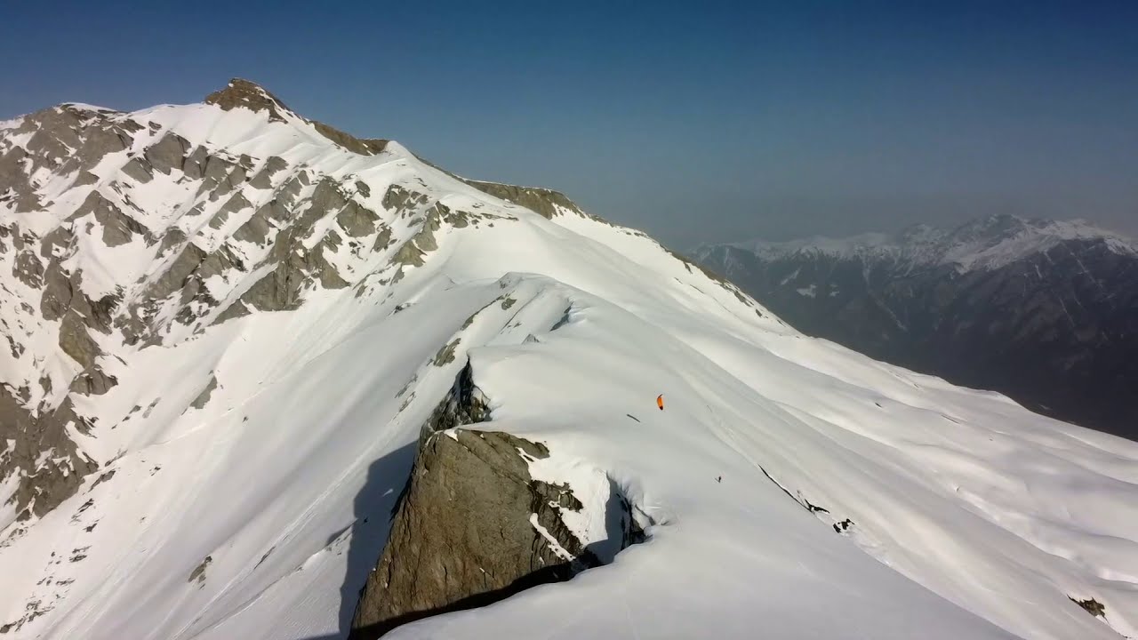Snowkiting at the edge in the Swiss mountains at Calanda