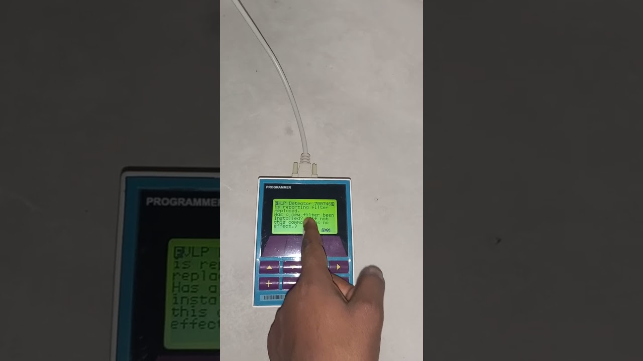 How to reset the fault of a replaced filter in a vesda system  using a programmer tool.