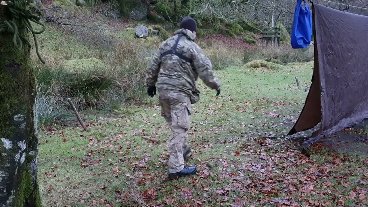 Staking out the tarp.  Dartmoor 4th Dec 2024
