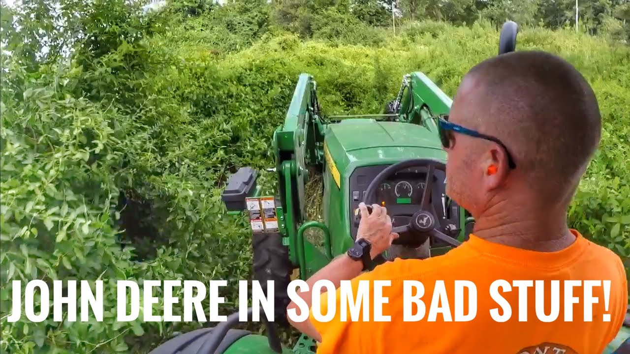 John Deere 5075E Bushhogging-brushhogging an overgrown lot with 3-4