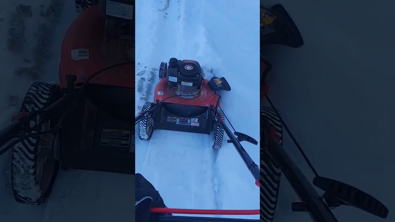 Mowing snow with a crappy push mower.