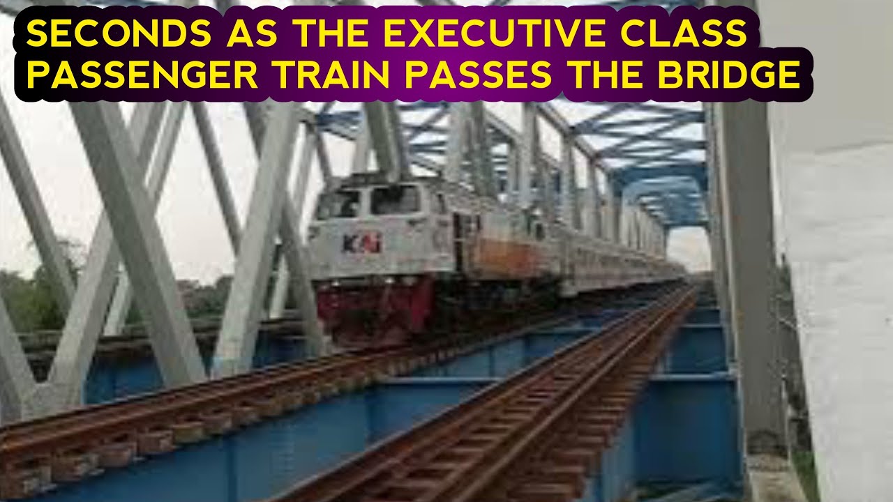 SECONDS AS THE EXECUTIVE CLASS PASSENGER TRAIN PASSES THE BRIDGE