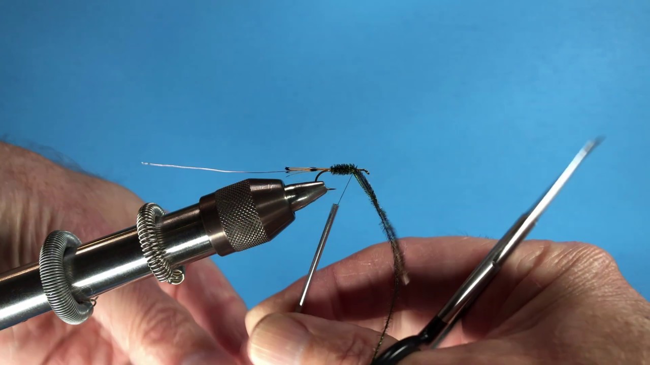 Peacock herl tied in by barb tips